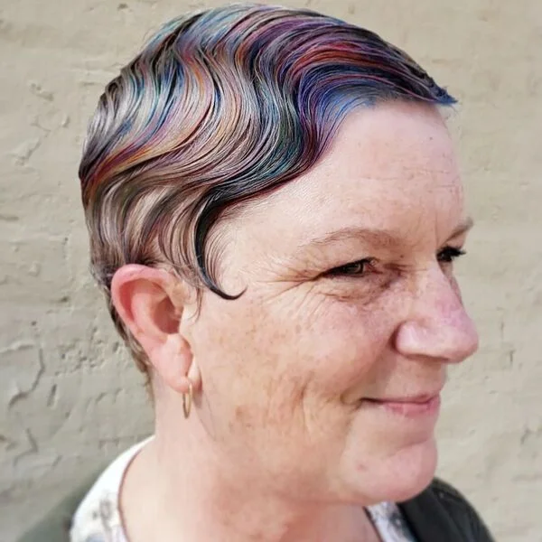 Subtle Rainbow Waves - a woman wearing dyed shirt with cardigan.