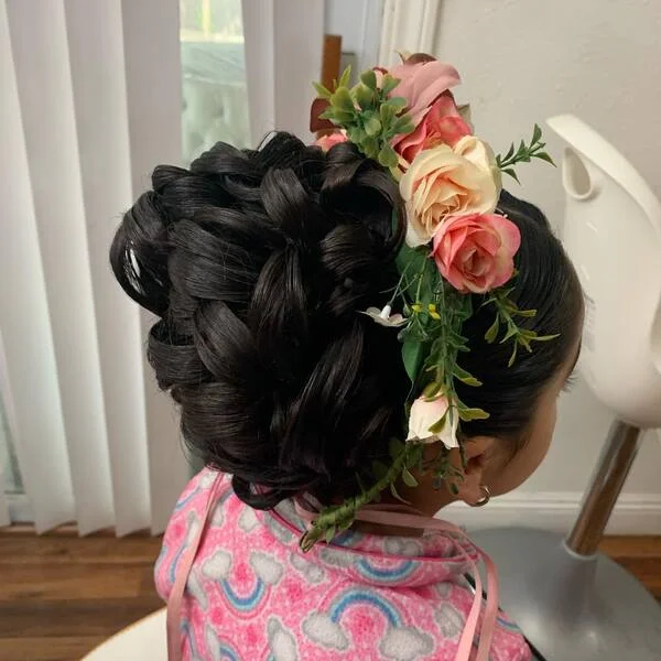 Textured Blunt Bun with Flowers - a girl is wearing pink clouds top.