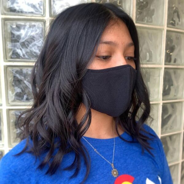 Textured Shoulder Length Haircut - a woman wearing black cotton mask in blue shirt.
