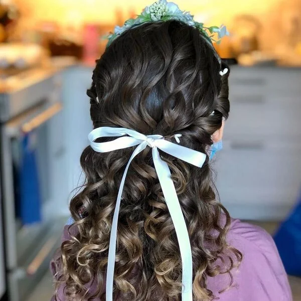 Tight Curly Hair with Flower Crown - a girl is wearing lavender top.