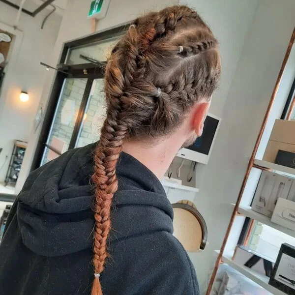 Twist and Fishbone Braids Pony - a woman wearing black hooded jacket.