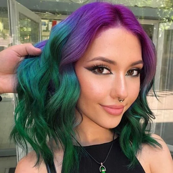 A woman wearing black halter top