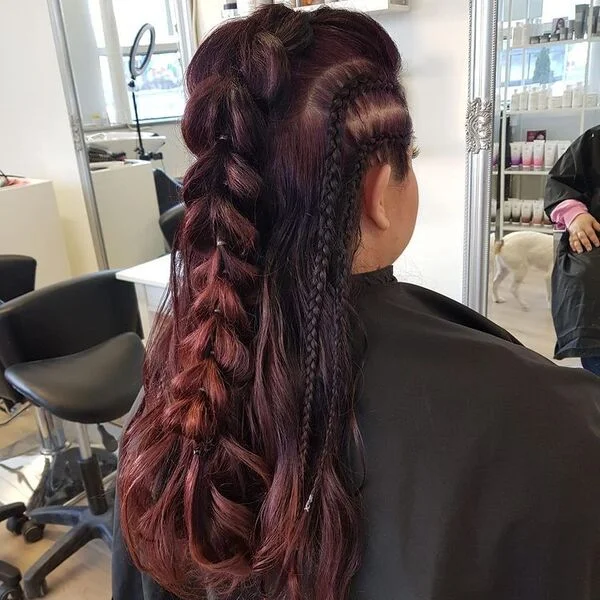 A woman wearing black plain salon cape - Viking Hairstyles Women