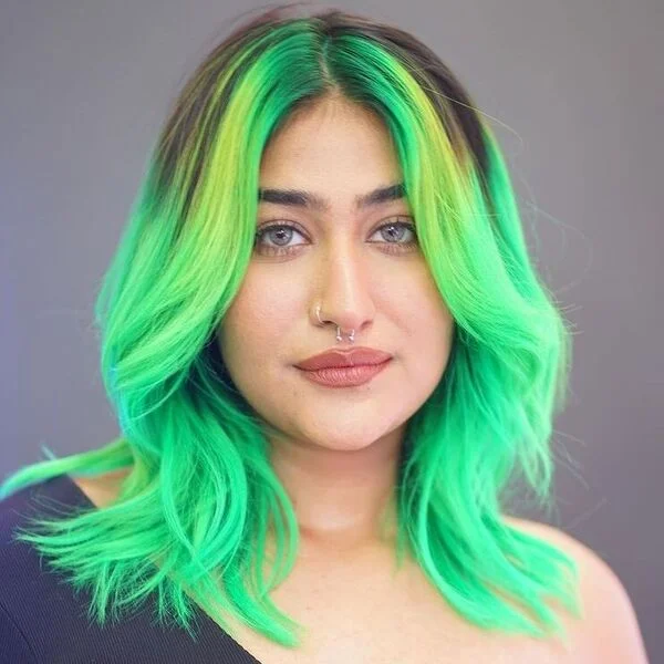 A woman wearing black one sided top