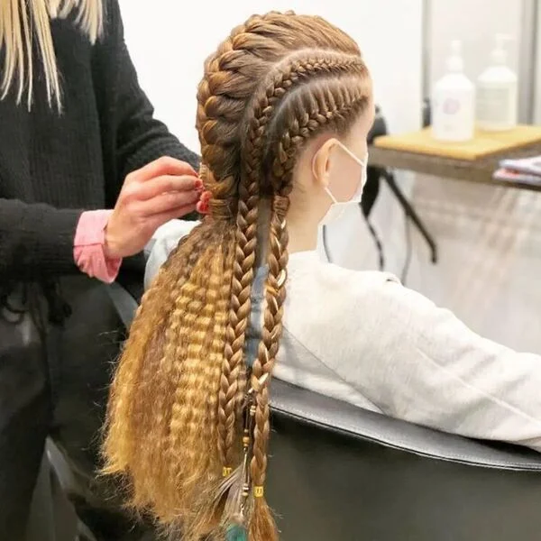 A woman wearing white sweater - Viking Hairstyles Women
