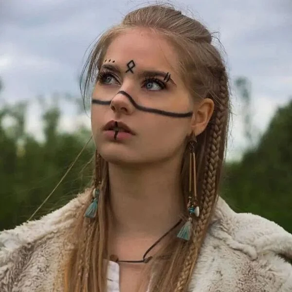 A woman wearing feather jacket - Viking Hairstyles Women