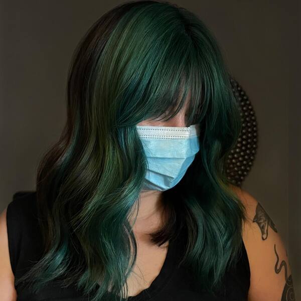 Moss Green Shades with Curtain Bangs - a woman wearing mask