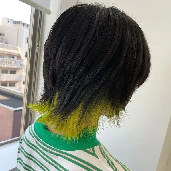 A woman wearing green stripes