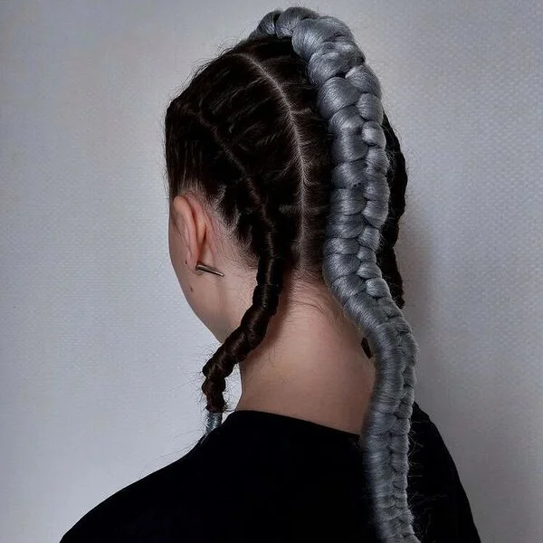 A woman wearing black top - Viking Hairstyles Women