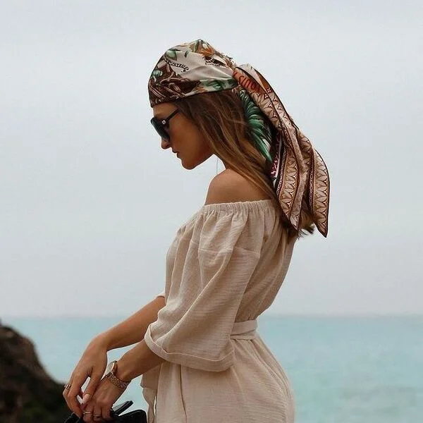 A woman wearing off shoulder suit