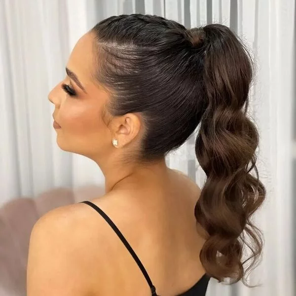 A woman wearing string strap black top