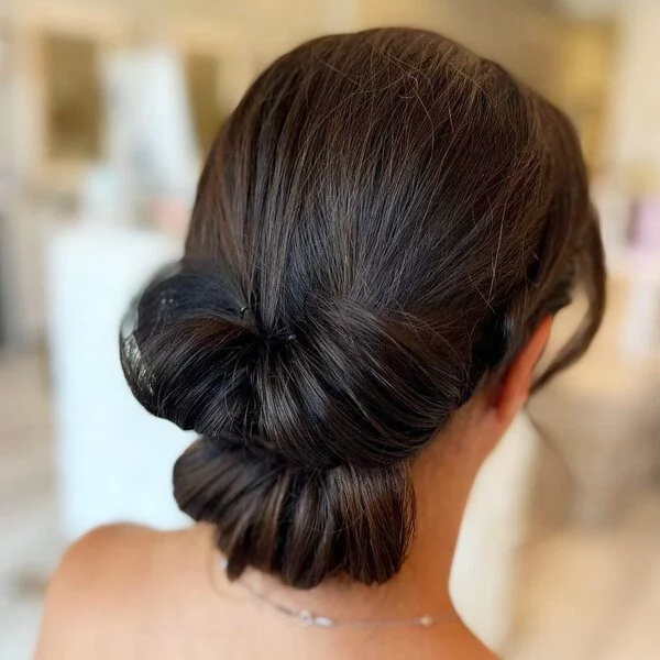 A woman wearing backless with necklace