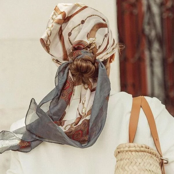 a woman wearing white polo top had her hair styled to Full Head Low Bun Knotted Scarf