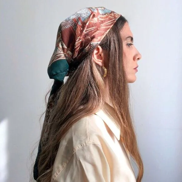 Woman wearing yellow polo showing gypsy style scarf hairstyle with triangle head wrap