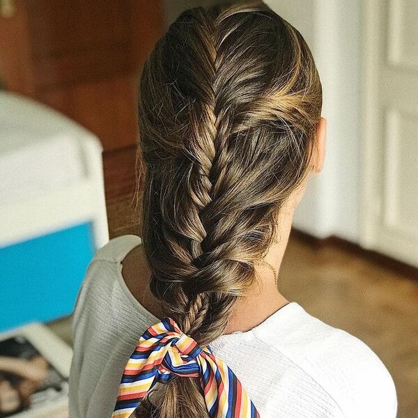 A woman wearing white blouse