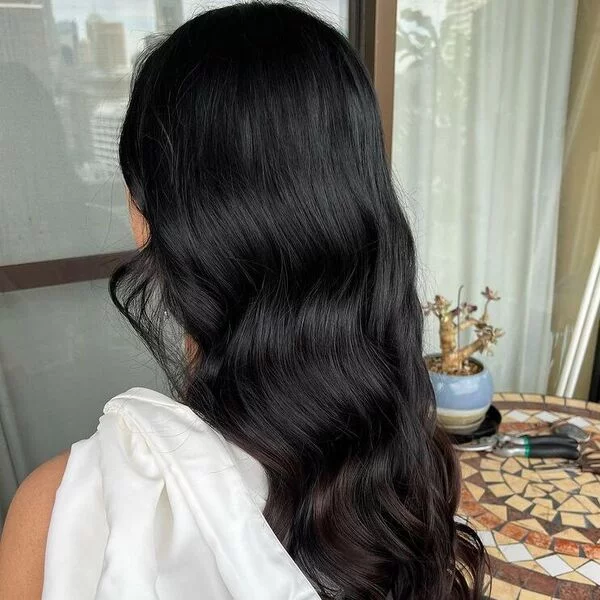 Graduation Hairstyles - A woman wearing elegant white dress