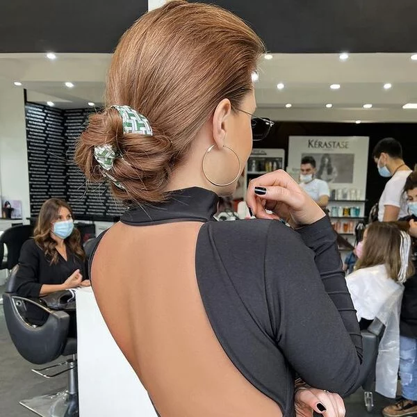 A woman wearing long sleeve backless top