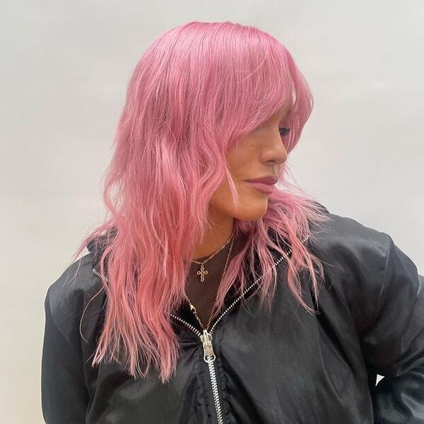 A woman wearing black zipper down jacket with her Shag Face Frame Pink Hairstyle